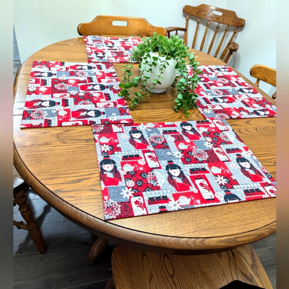 Placemats x 4. Japanese geisha girls theme. Bright red colours.